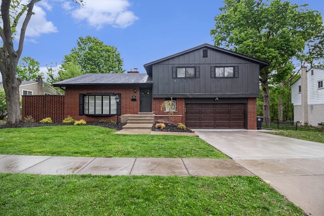 16114 Alpine Dr, Livonia, MI 48154 - tri-level home featuring brick siding, a garage, and concrete driveway