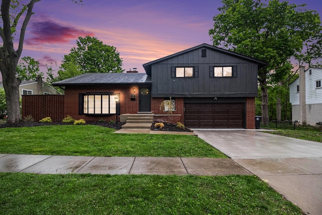 16114 Alpine Dr, Livonia, MI 48154 - split level home featuring brick siding, an attached garage, and driveway