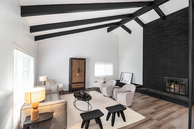 16114 Alpine Dr, Livonia, MI 48154 - living room with wood finished floors and a brick fireplace