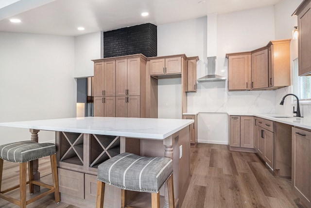 16114 Alpine Dr, Livonia, MI 48154 - kitchen with a sink, wall chimney range hood, dark wood-type flooring, a breakfast bar, and a center island