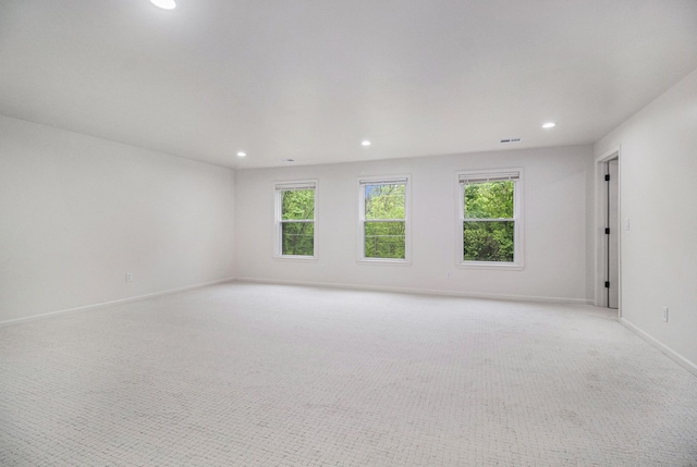 16114 Alpine Dr, Livonia, MI 48154 - empty room featuring recessed lighting, plenty of natural light, light carpet, and baseboards