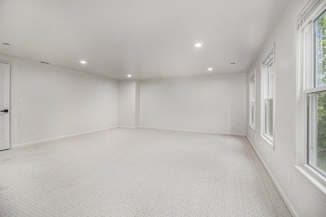 16114 Alpine Dr, Livonia, MI 48154 - spare room featuring recessed lighting, healthy amount of natural light, and baseboards