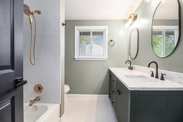 16114 Alpine Dr, Livonia, MI 48154 - bathroom with toilet, baseboards, double vanity, and shower / washtub combination