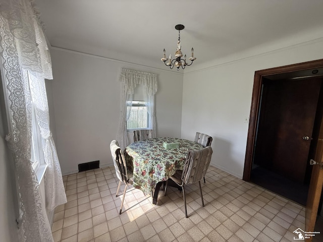 4971 Elm St, Newport, MI 48166 - dining room with a chandelier and crown molding