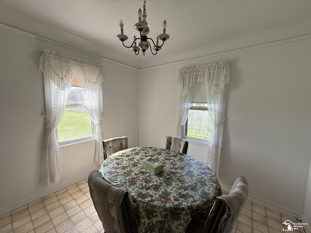 4971 Elm St, Newport, MI 48166 - dining area featuring a chandelier, baseboards, and light tile patterned flooring