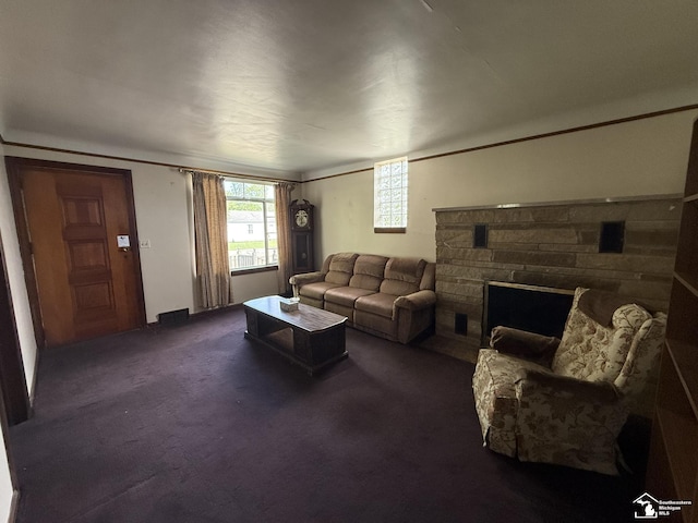 4971 Elm St, Newport, MI 48166 - living area featuring a stone fireplace and dark colored carpet