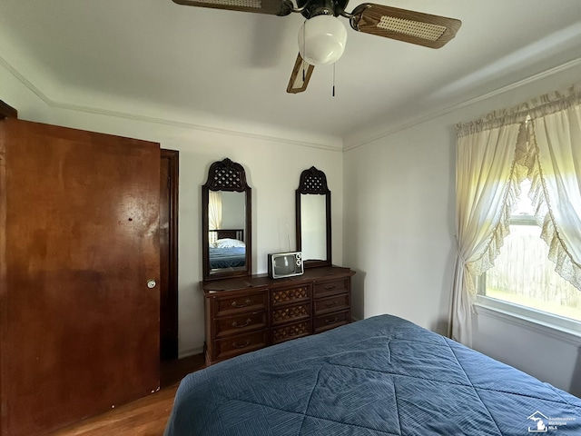 4971 Elm St, Newport, MI 48166 - bedroom with wood finished floors, ceiling fan, and crown molding