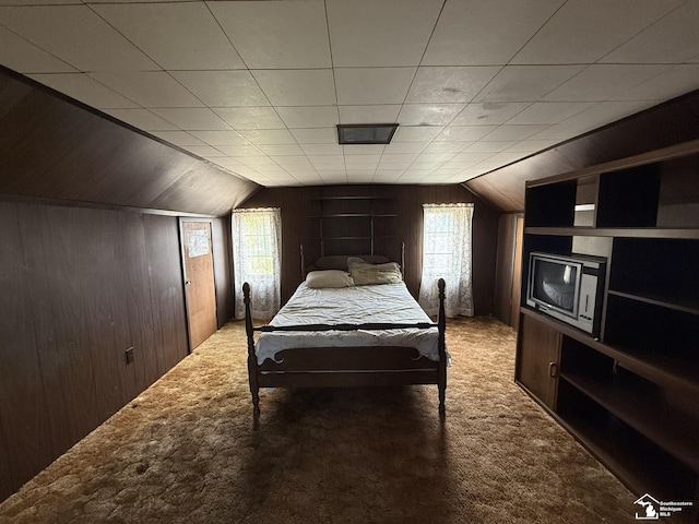 4971 Elm St, Newport, MI 48166 - carpeted bedroom featuring wood walls and vaulted ceiling