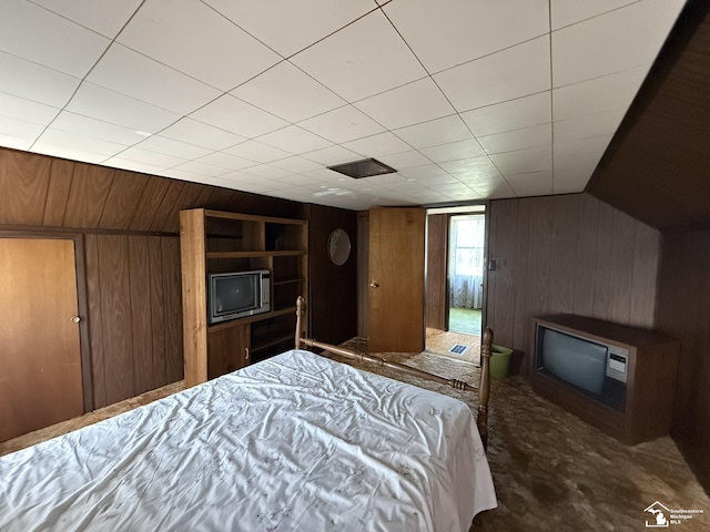 4971 Elm St, Newport, MI 48166 - carpeted bedroom with wooden walls