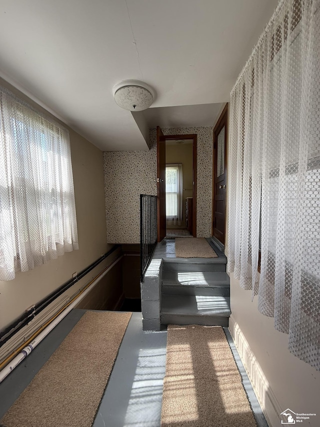 4971 Elm St, Newport, MI 48166 - hallway with wallpapered walls and a wainscoted wall
