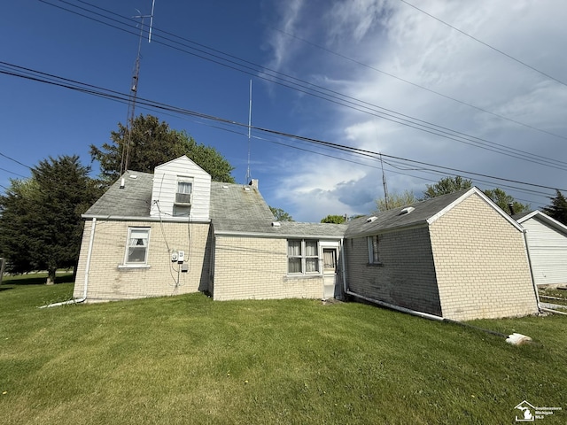 4971 Elm St, Newport, MI 48166 - back of property featuring brick siding and a lawn