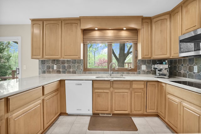 1663 Tacoma Dr, Rochester Hills, MI 48306 - kitchen featuring dishwasher, stainless steel microwave, a sink, and plenty of natural light