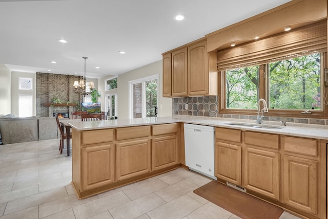 1663 Tacoma Dr, Rochester Hills, MI 48306 - kitchen featuring white dishwasher, a sink, light countertops, recessed lighting, and a chandelier