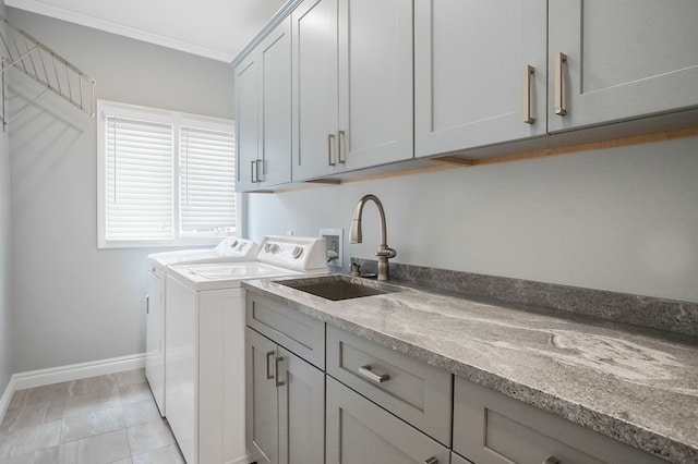 1663 Tacoma Dr, Rochester Hills, MI 48306 - washroom featuring washing machine and clothes dryer, cabinet space, baseboards, ornamental molding, and light tile patterned floors