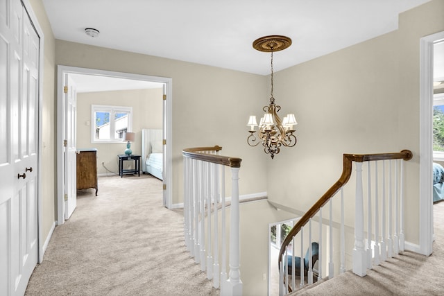 1663 Tacoma Dr, Rochester Hills, MI 48306 - hall featuring an upstairs landing, carpet, a chandelier, and baseboards