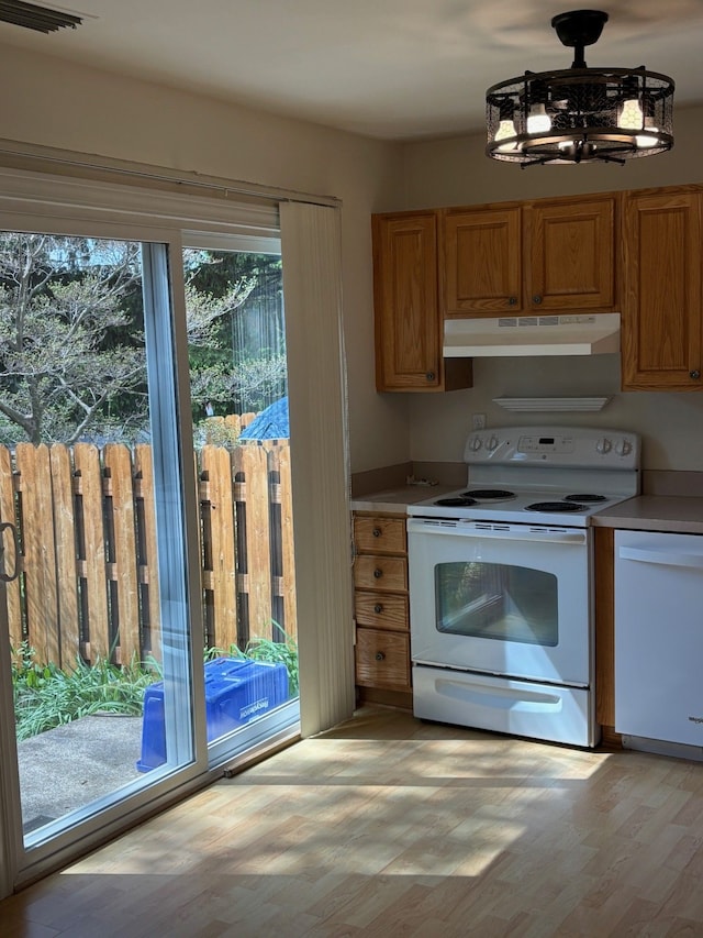 1163 Marquette Ct, Rochester Hills, MI 48307 - kitchen featuring white appliances, under cabinet range hood, light wood-type flooring, and light countertops