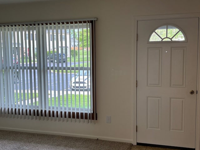 1163 Marquette Ct, Rochester Hills, MI 48307 - foyer entrance featuring baseboards and carpet floors
