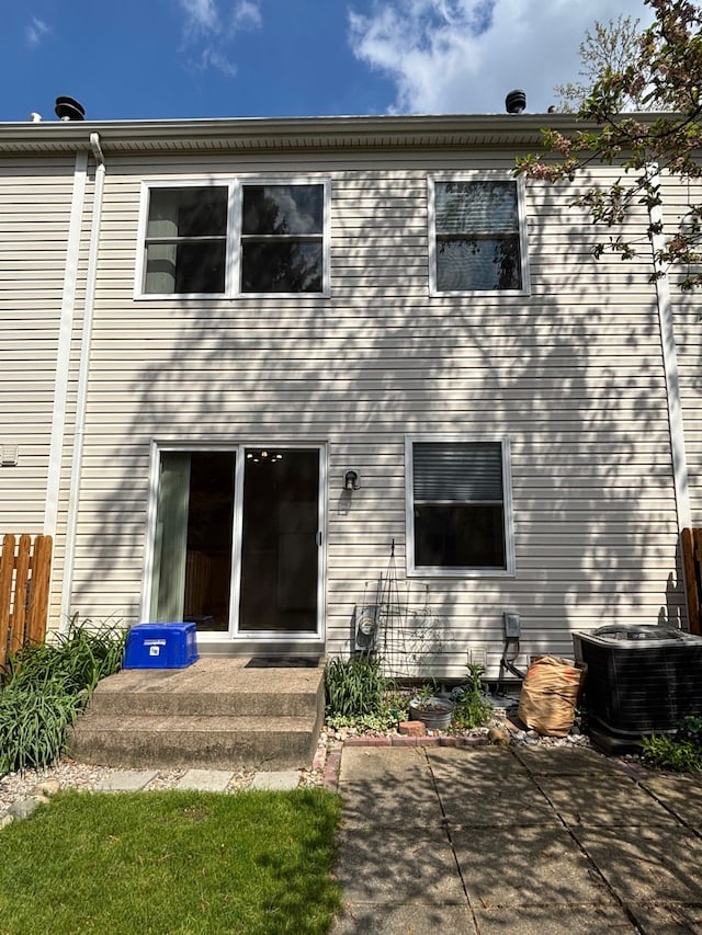 1163 Marquette Ct, Rochester Hills, MI 48307 - back of house featuring central AC unit, a patio area, and fence