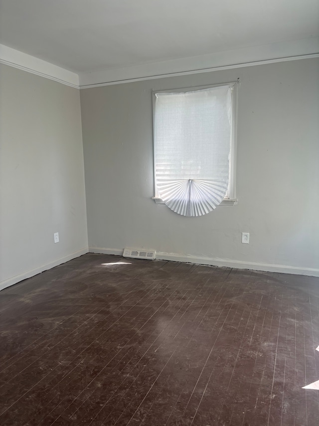 16828 W Chicago St, Detroit, MI 48228 - spare room featuring dark wood finished floors, baseboards, and ornamental molding