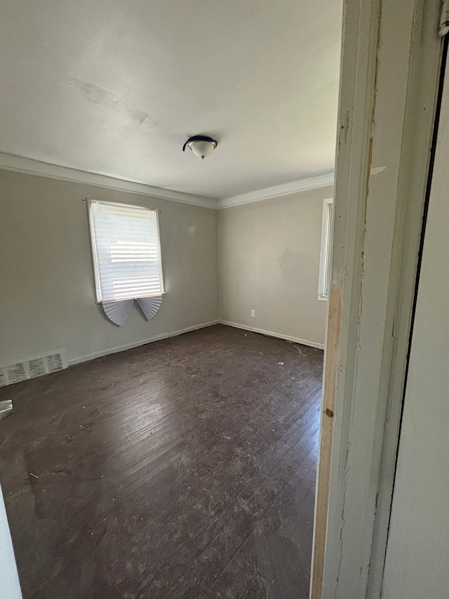 16828 W Chicago St, Detroit, MI 48228 - spare room featuring ornamental molding, dark wood-style floors, and baseboards