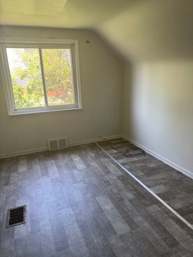 16828 W Chicago St, Detroit, MI 48228 - additional living space with vaulted ceiling, wood finished floors, and baseboards