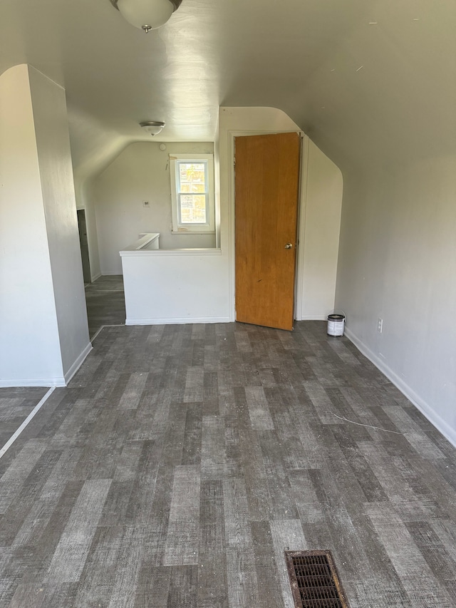 16828 W Chicago St, Detroit, MI 48228 - bonus room featuring vaulted ceiling, baseboards, and dark carpet