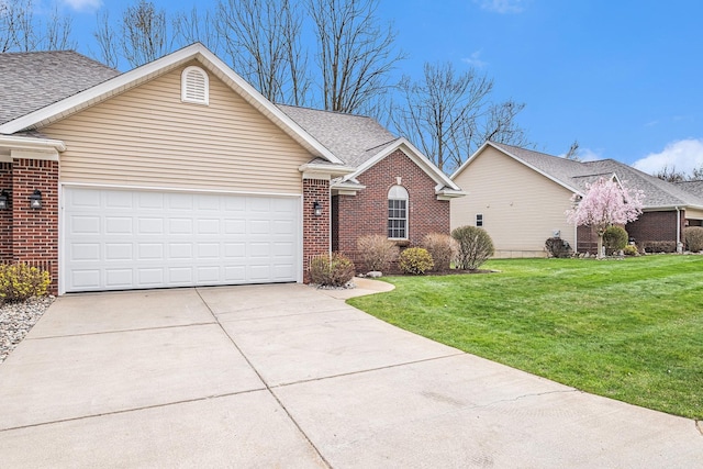 5489 Hidden Oak Cir, Linden, MI 48451 - view of front of home with a garage, brick siding, concrete driveway, and a front yard