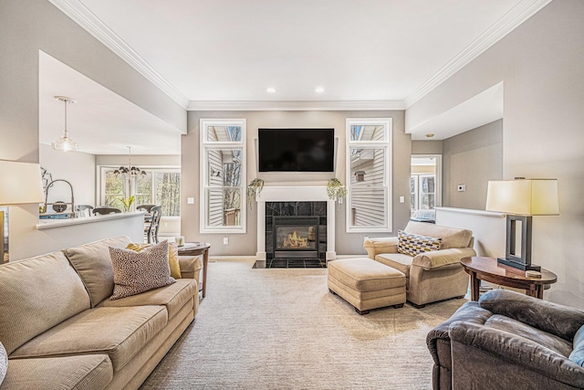 5489 Hidden Oak Cir, Linden, MI 48451 - carpeted living area featuring crown molding, a fireplace, baseboards, recessed lighting, and a chandelier