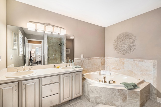 5489 Hidden Oak Cir, Linden, MI 48451 - bathroom featuring a stall shower, a whirlpool tub, double vanity, and tile patterned floors