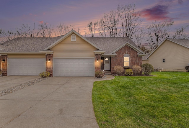 5489 Hidden Oak Cir, Linden, MI 48451 - view of front of house featuring brick siding, driveway, a garage, and a front lawn
