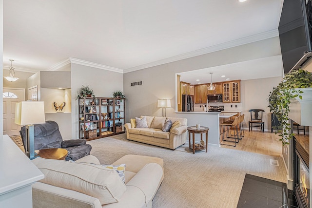 5489 Hidden Oak Cir, Linden, MI 48451 - living room featuring ornamental molding and recessed lighting