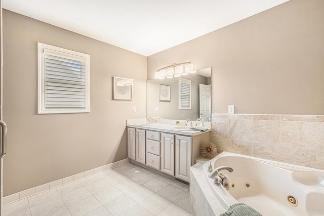 5489 Hidden Oak Cir, Linden, MI 48451 - bathroom featuring tile patterned flooring, a tub with jets, double vanity, and baseboards
