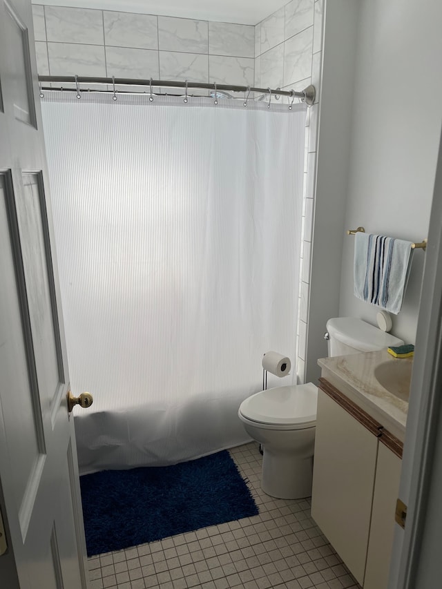 1309 Division St, Port Huron, MI 48060 - full bathroom featuring toilet, vanity, tile patterned floors, and shower / bath combination with curtain