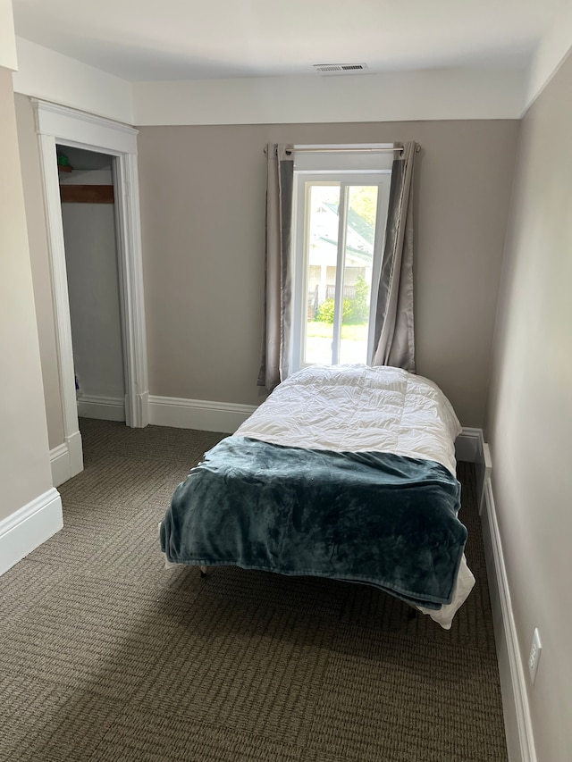 1309 Division St, Port Huron, MI 48060 - carpeted bedroom featuring baseboards