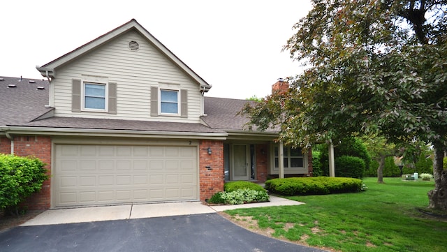 2 Cornell Ct, Dearborn, MI 48124 - traditional-style house featuring brick siding, asphalt driveway, a front yard, and an attached garage