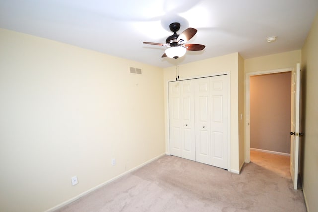 2 Cornell Ct, Dearborn, MI 48124 - unfurnished bedroom featuring light carpet, a closet, baseboards, and ceiling fan