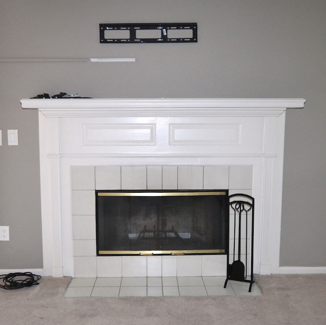 2 Cornell Ct, Dearborn, MI 48124 - detailed view of a tile fireplace, carpet flooring, and baseboards