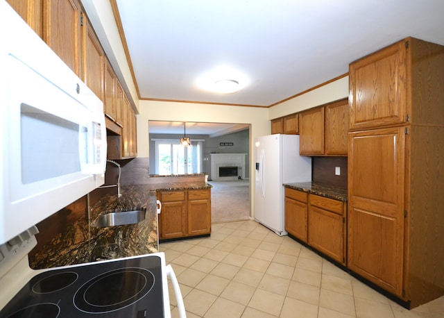 2 Cornell Ct, Dearborn, MI 48124 - kitchen with white appliances, brown cabinetry, light tile patterned floors, and ornamental molding