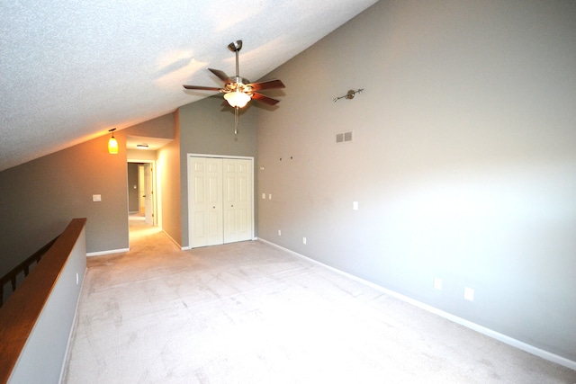 2 Cornell Ct, Dearborn, MI 48124 - unfurnished bedroom featuring vaulted ceiling, light colored carpet, a closet, and baseboards