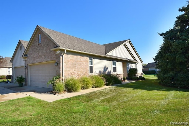34214 Birchway Cir, Sterling Heights, MI 48312 - view of side of home with a lawn, brick siding, driveway, and roof with shingles