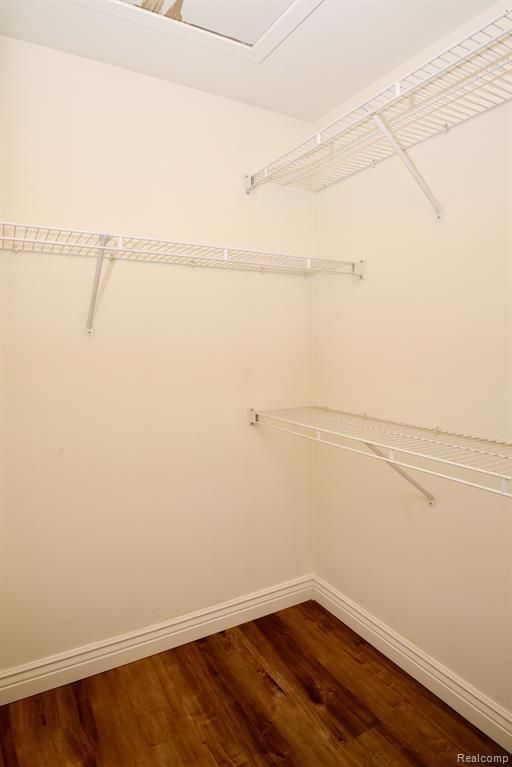 34214 Birchway Cir, Sterling Heights, MI 48312 - spacious closet featuring dark wood-style flooring