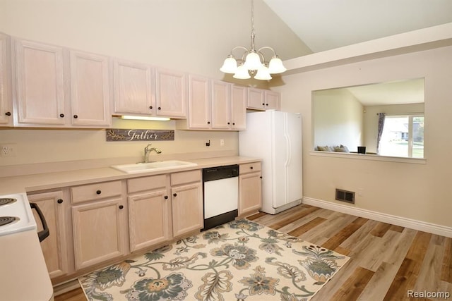 34214 Birchway Cir, Sterling Heights, MI 48312 - kitchen with white appliances, a sink, a chandelier, light wood-style flooring, and light countertops