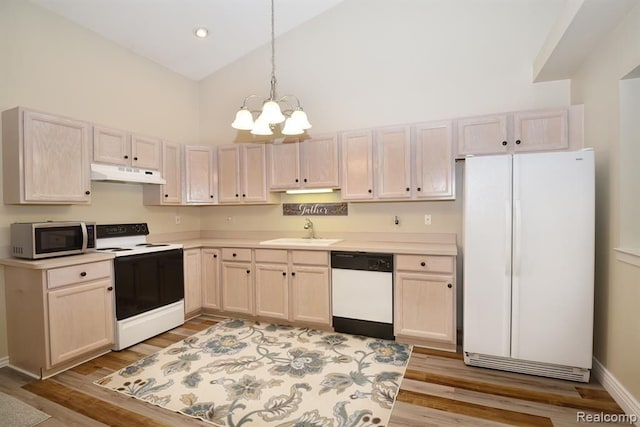 34214 Birchway Cir, Sterling Heights, MI 48312 - kitchen with white appliances, under cabinet range hood, high vaulted ceiling, a sink, and a chandelier