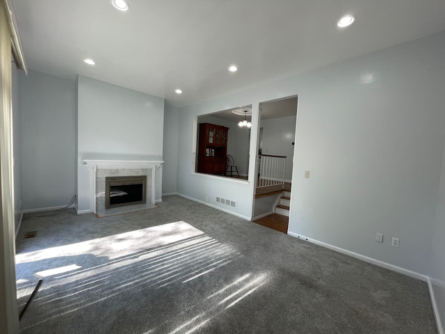 1840 Brentwood Dr, Troy, MI 48098 - unfurnished living room with carpet flooring, a high end fireplace, recessed lighting, stairway, and baseboards