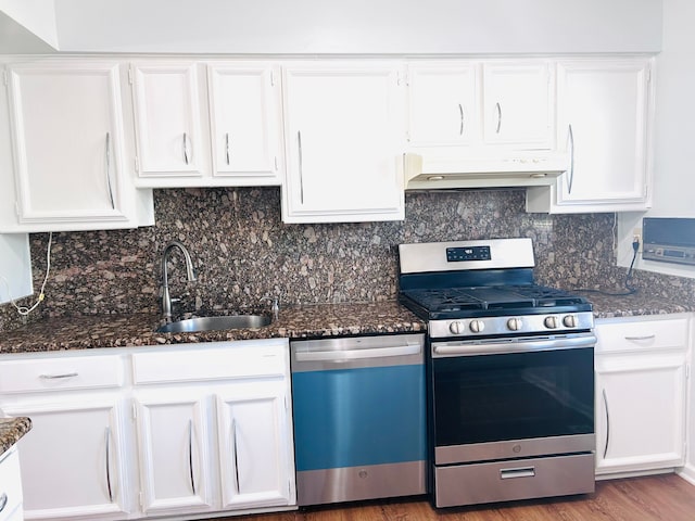 1840 Brentwood Dr, Troy, MI 48098 - kitchen featuring dishwasher, stainless steel range with gas stovetop, a sink, under cabinet range hood, and white cabinets