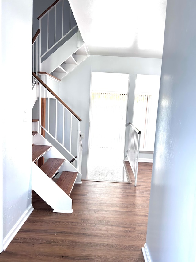 1840 Brentwood Dr, Troy, MI 48098 - foyer with wood finished floors, stairs, baseboards, and vaulted ceiling