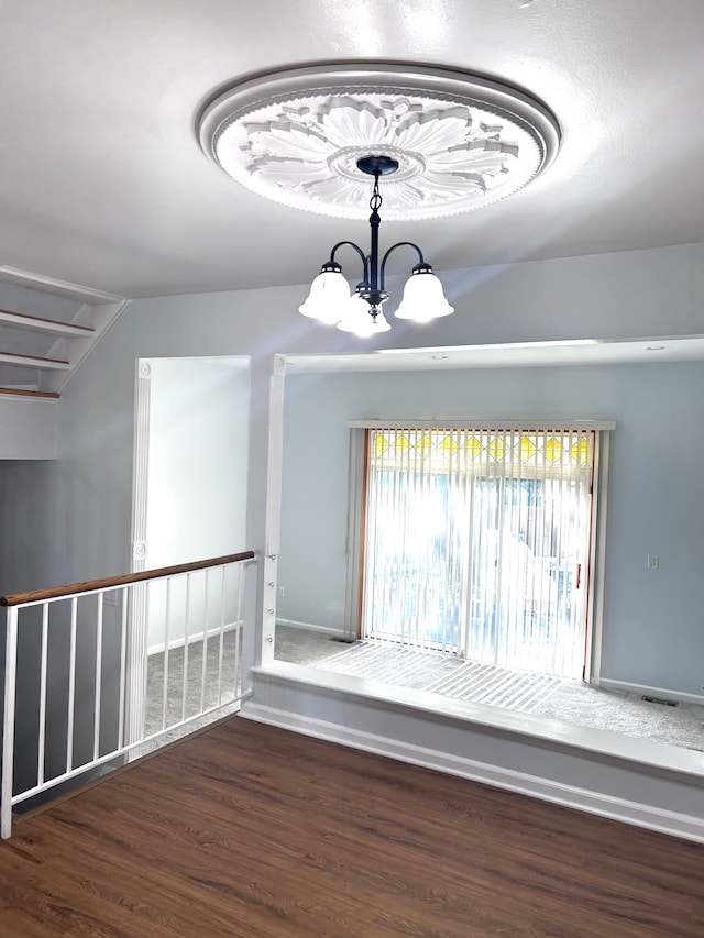 1840 Brentwood Dr, Troy, MI 48098 - spare room with a chandelier and wood finished floors