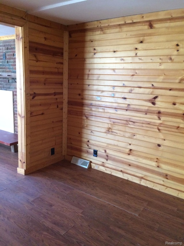 164 W Morehouse Ave N, Hazel Park, MI 48030 - empty room featuring dark wood-style flooring and wood walls