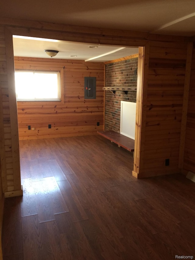 164 W Morehouse Ave N, Hazel Park, MI 48030 - spare room with electric panel, dark wood-style flooring, and wooden walls
