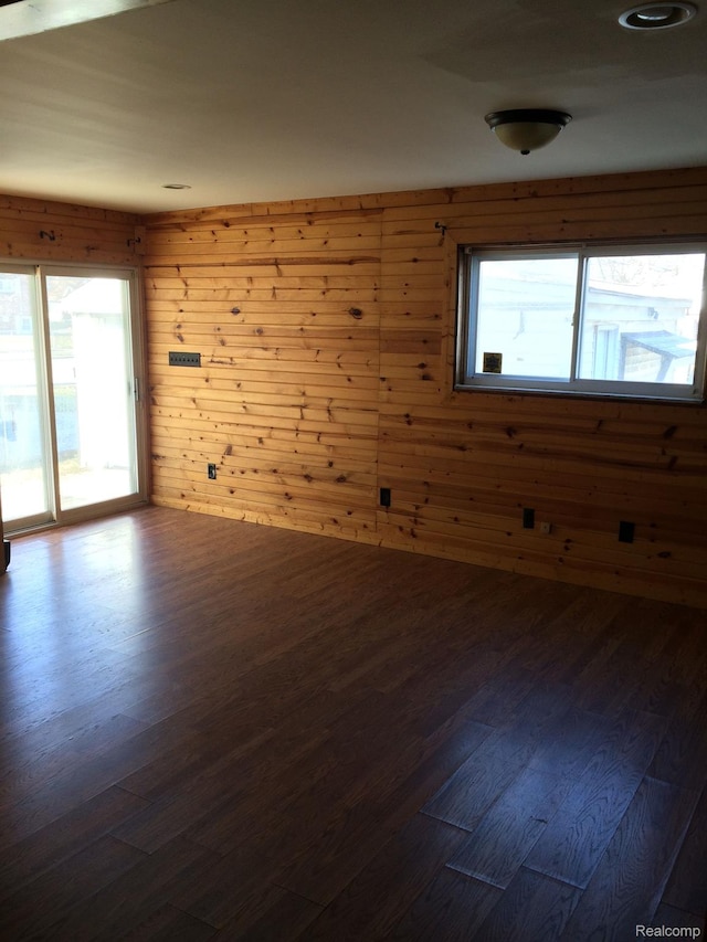 164 W Morehouse Ave N, Hazel Park, MI 48030 - spare room with plenty of natural light, dark wood-style flooring, and wood walls